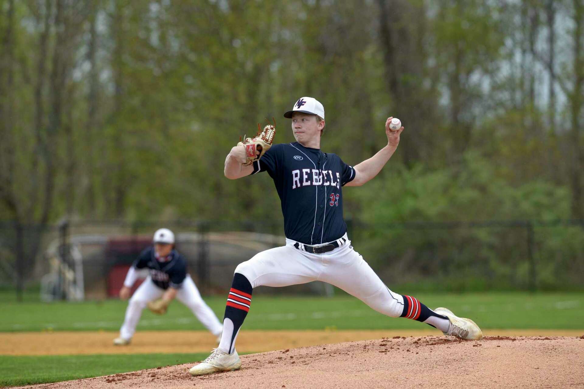 Braden Quinn delivering a powerful pitch for New Fairfield High, showcasing the early skills that would carry him to the MLB draft.